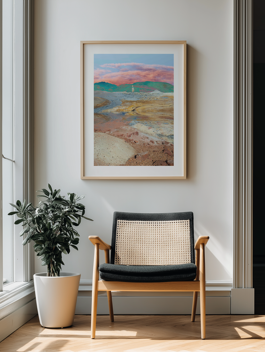 Modern interior with a framed landscape painting, chair, and plant.