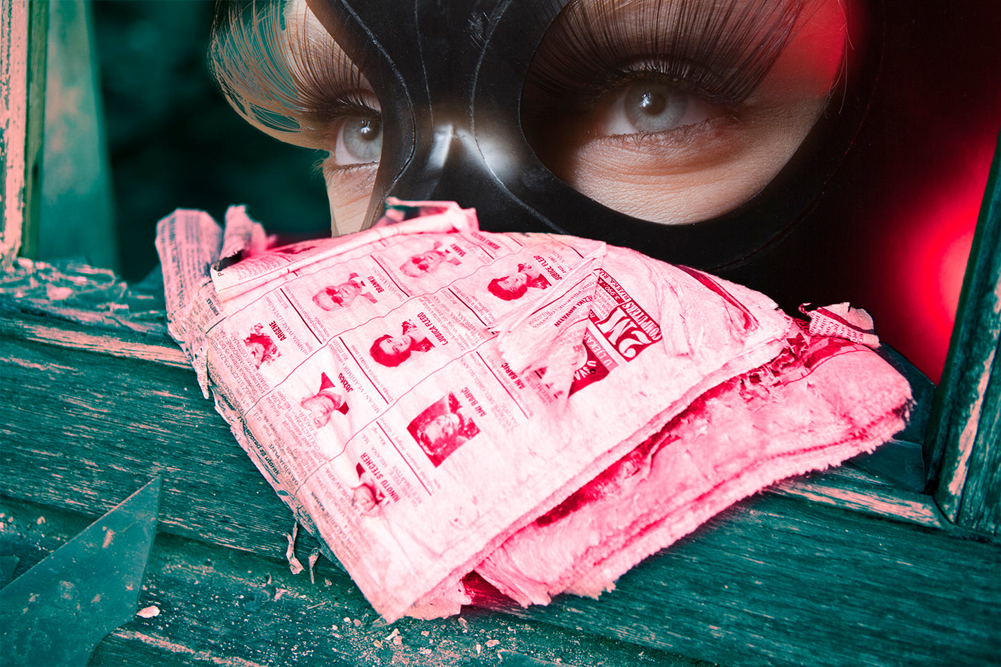 Artistic poster featuring a close-up of a person's eye looking over a red textured surface, with a blurred background.