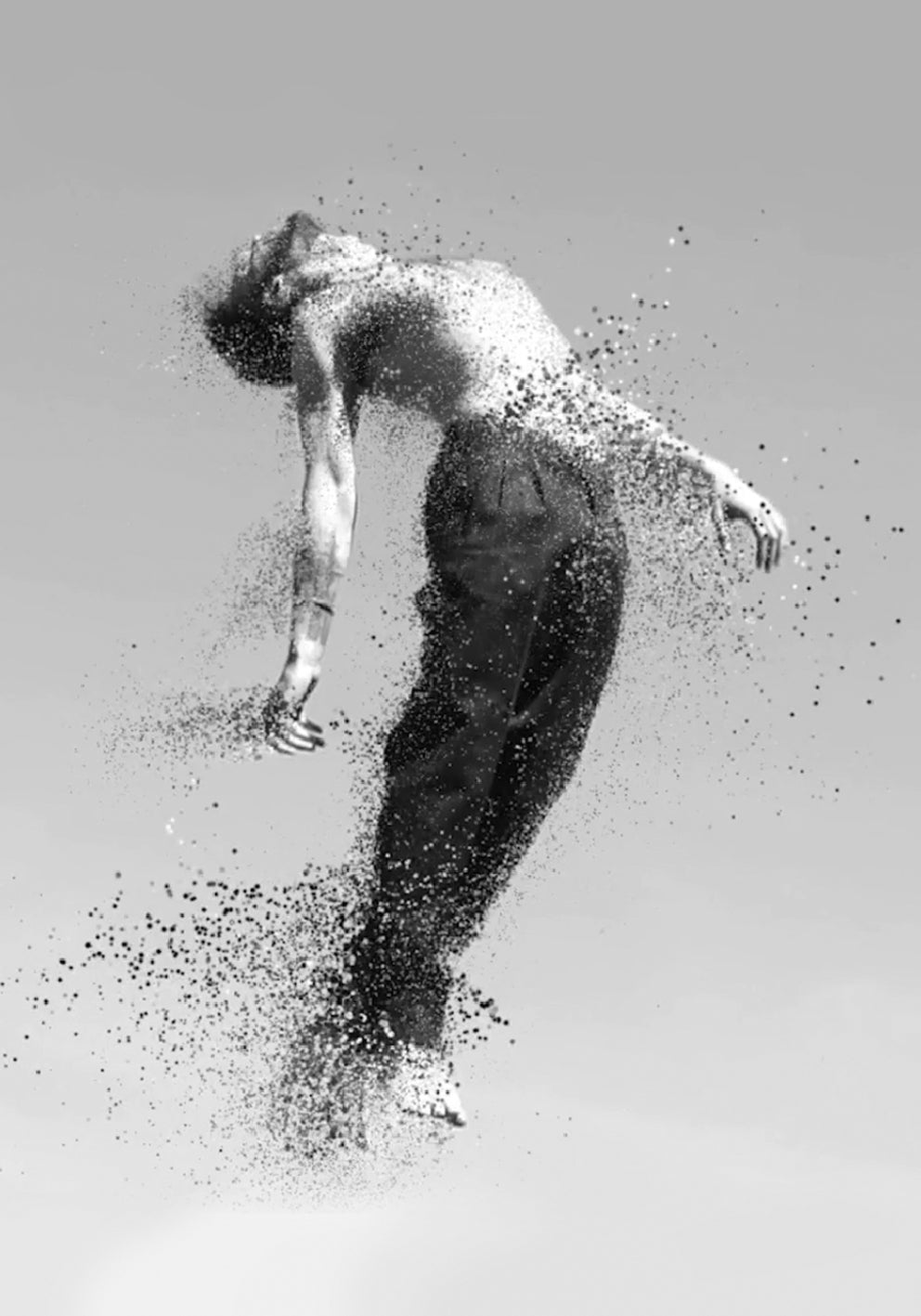 Black and white artistic depiction of a person breaking apart into particles on a light gray background